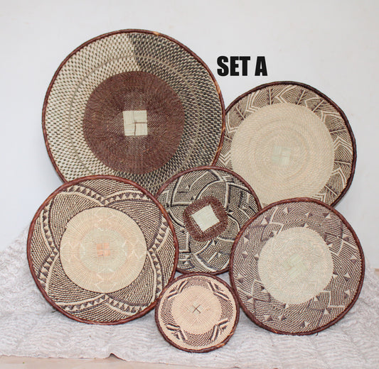 Set of woven baskets with different patterns on a white surface
