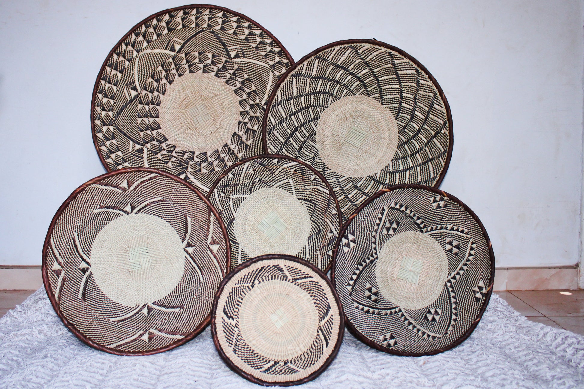 a set of 6 Tonga geometric baskets