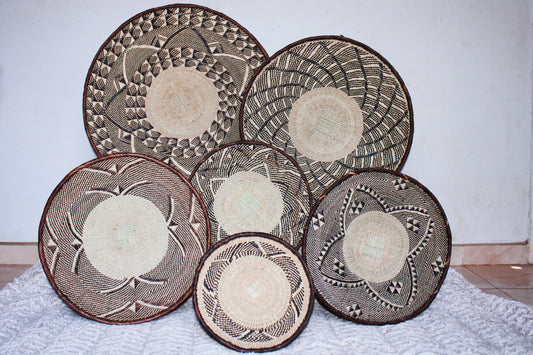 a set of 6 Tonga geometric baskets